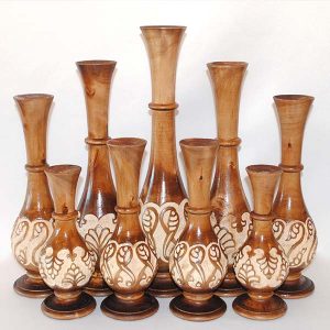 a set of handcrafted wooden vases