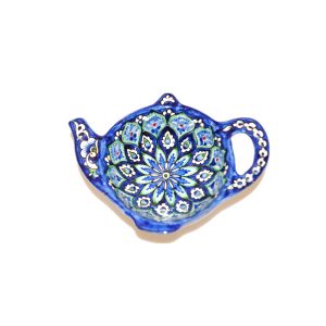 small teapot shaped plate with multicoloured design